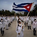 A brigade of volunteer health professionals attend a farewell ceremony..jpg